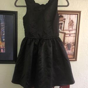 black dress with gold zipper on the back